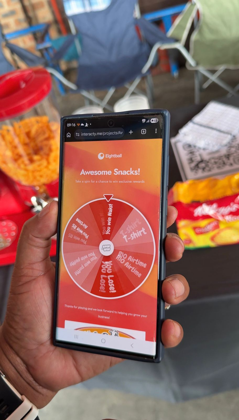 Customer interacting with the Awesome Snacks digital spin-and-win activation