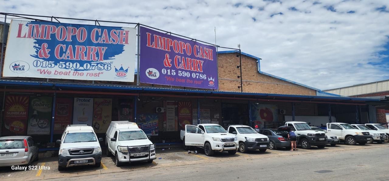 Bioko Works activation team standing behind a branded promotion table